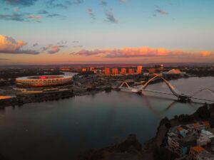 Sunset Over Perth Hills. Iconic View of Optus Stadium & Matagarup Bridge Golden sunset over Perth Hills with Optus Stadium and Matagarup Bridge in view. Showcasing the beauty of Western Australia’s capital city skyline.