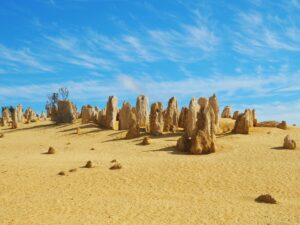 Breathtaking Pinnacles Desert in Western Australia Limestone spires rising from golden sand dunes at the Pinnacles Desert in Nambung National Park, Western Australia.